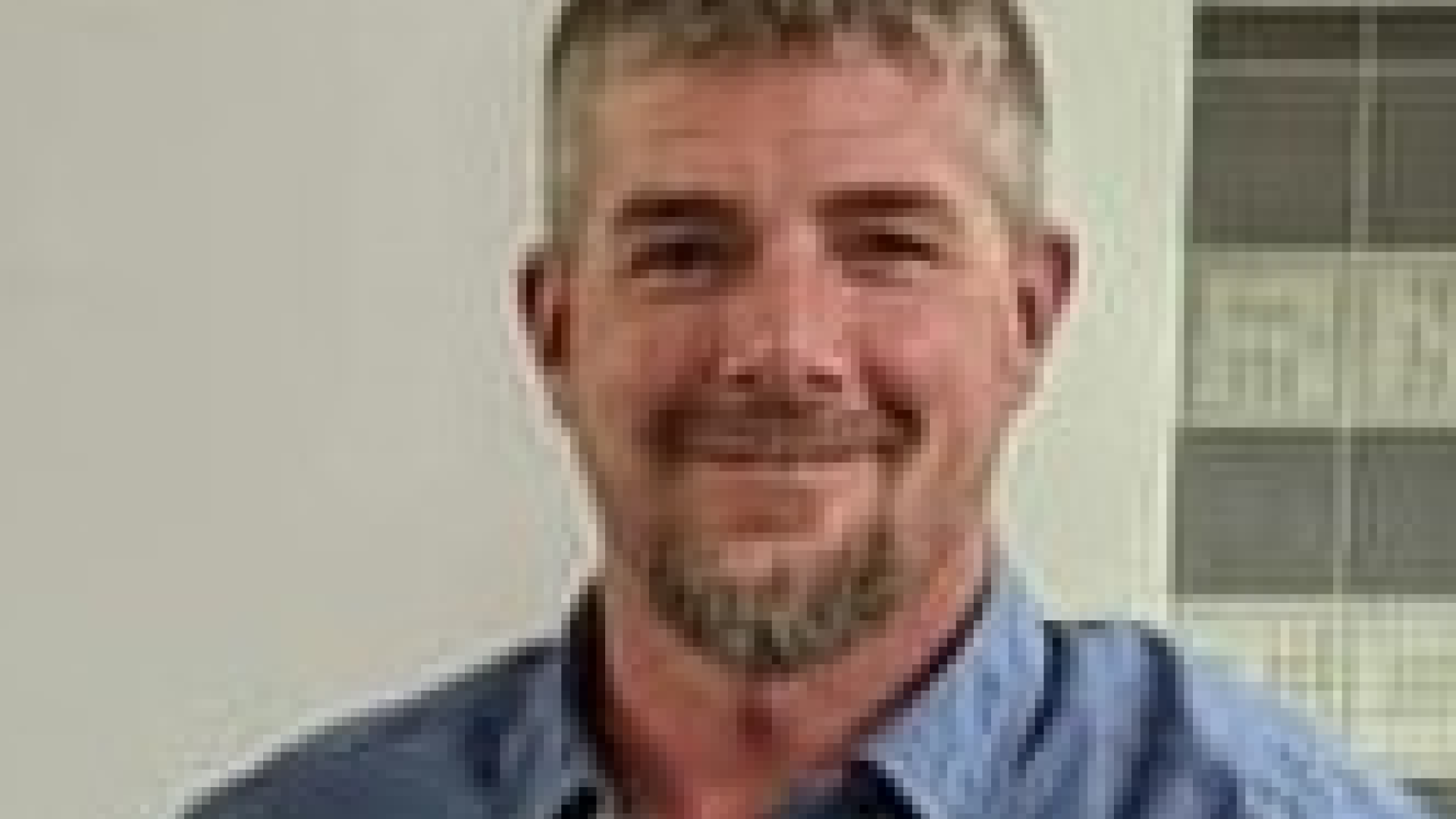 Headshot of Councillor Michael Rickward. There is a man with short gray hair and a goatee smiling.